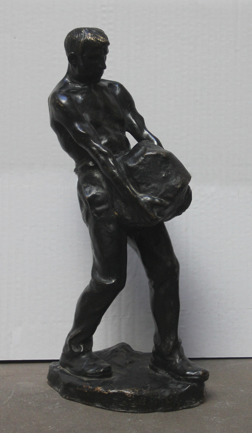 Worker carrying stone