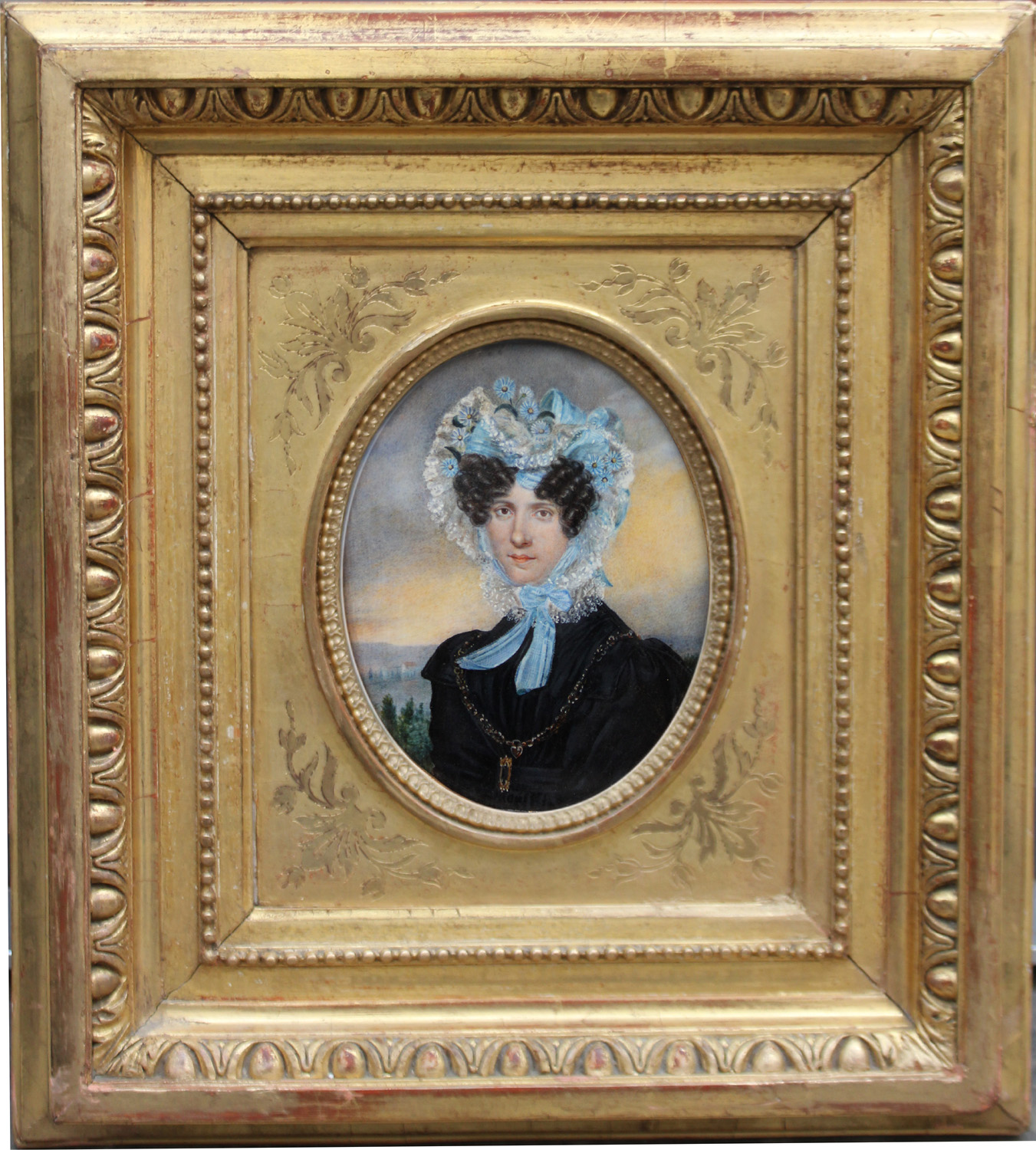 Portrait of young lady in black dress and with lace bonnet