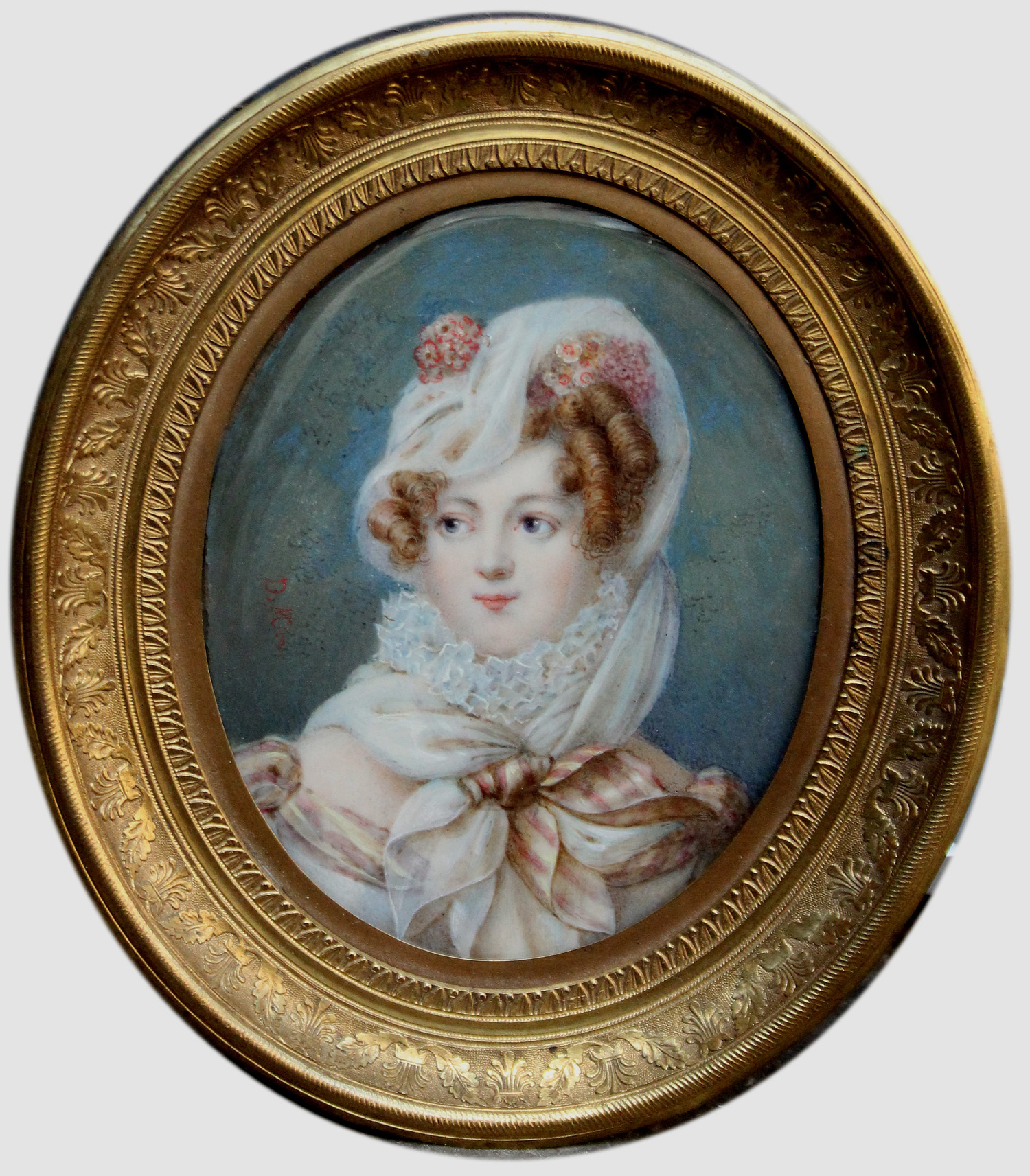 Portrait miniature of a woman wearing a veil and her hair adorned with flowers.