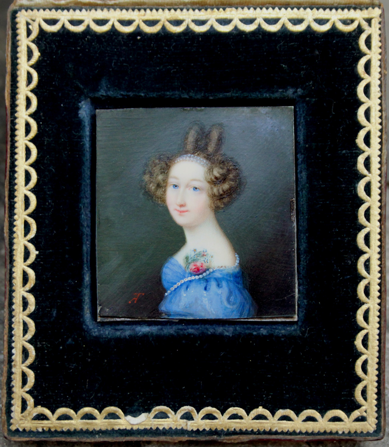 Portrait miniature of a young woman in the original leather etui
